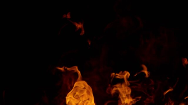 Super slow motion of fire blast isolated on black background. Filmed on high speed cinema camera, 1000 fps