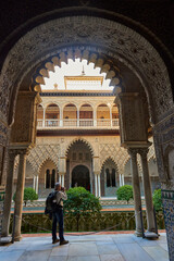 Fototapeta premium View of the Medieval garden and courtyard, the Patio de las Doncellas, of the Royal Palace, Sevilla, Spain, Europe.
