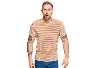 Young irish man wearing casual clothes scared and amazed with open mouth for surprise, disbelief...