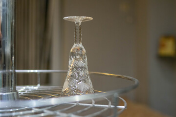 Crystal glass. Wine glass on the bar. Hangover. Empty wine glass. Alcohol. Holidays.