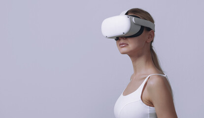 young woman in vr helmet on her head on a light background