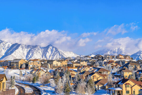 Aerial view of a homes in snowy neighborhood of scenic Highland Utah in winter