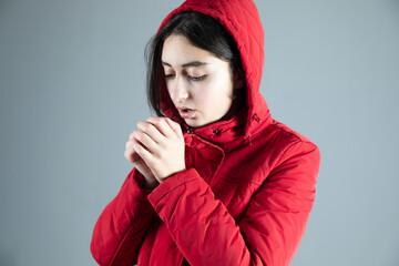 a cold woman winter coat in studio