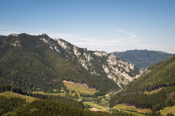 Fototapeta na wymiar Rocky mountains know as Tiesnavy and Vratna Dolina valley in Natural park Mala Fatra, Slovakia. Beautiful view at mountain and forest with clear sky at summer