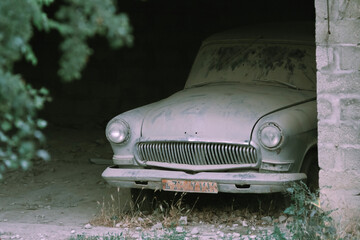 abandoned retro car in the old quarter - vintage car