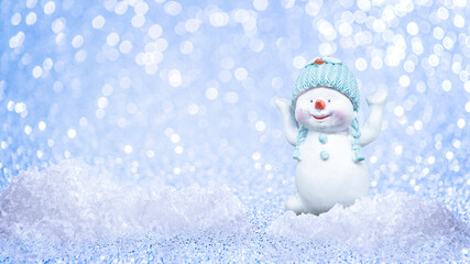 Happy snowman in winter bokeh glitter background with copy space