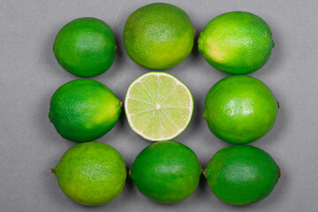 Fresh citrus limes and one half inside