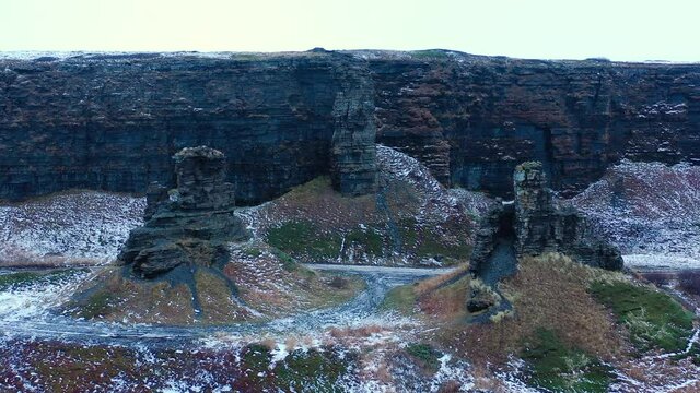 Rybachy Peninsula, Russia, Dva Brata. Weathered rock formations "Two Brothers".