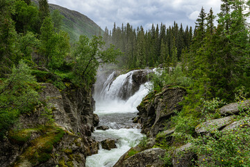 View to the Rjukandefoss waterfall through a canyon