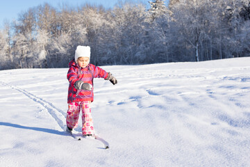 4 year old girl on cross-country skiing. Family sports. Beautiful winter landscape.