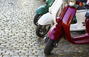 vintage scooters , sidewalk. Vintage scooters on a city street in retro style. italian style concept