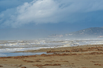 Italy Tuscany Maremma Grosseto, Marina di Grosseto beach, view of the stormy sea, Castiglione della Pescaia in the background