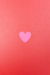 Pink heart on a red background. Valentine's Day