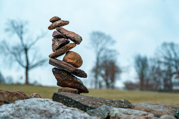 Fototapeta na wymiar Intricately balanced cairn in Rockefeller State Park in New York State