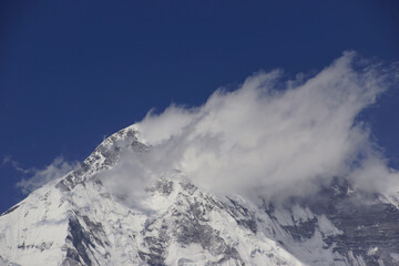 Fototapeta na wymiar Summit of Mount Everest covered in clouds. Photographed from Gokyo Ri. One of the best view points on Everest. 