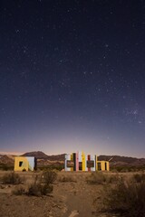 Starry night sky over a derelict house in the middle of the desert near Uspallata, Mendoza,...