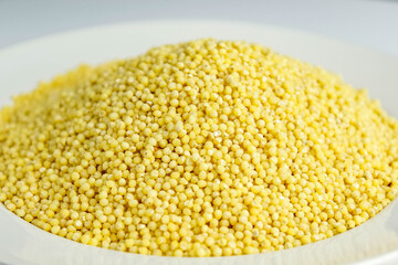 Fresh crumbly millet in a white plate.