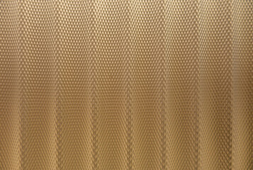 abstract background of golden embossed plastic surface close up
