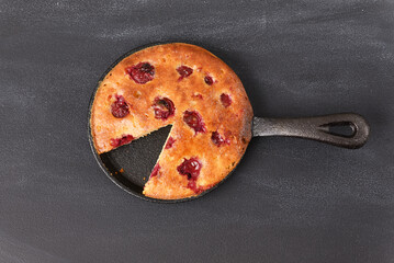 Sour cherry cake in a pan. Top view.