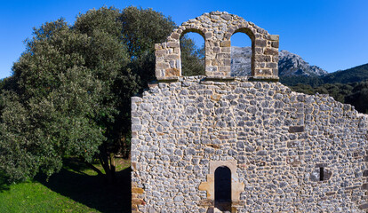 View from a drone of the ruins of the hermitage of San Julian in the Liendo Valley in Cantabria,...