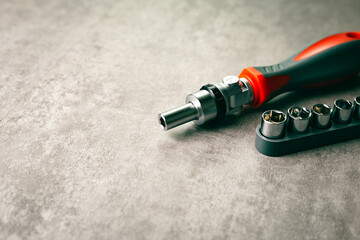 Hand tool concept. Nut driver with bolts and attachments.