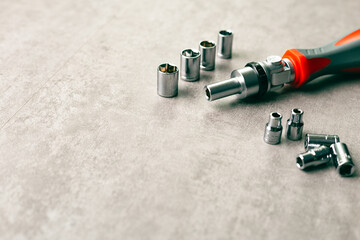 Hand tool concept. Nut driver with bolts and attachments.