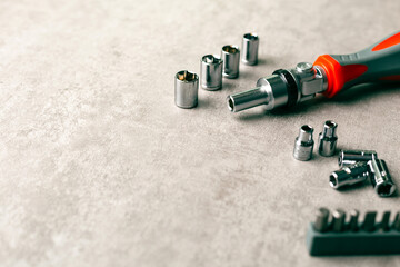 Hand tool concept. Nut driver with bolts and attachments.