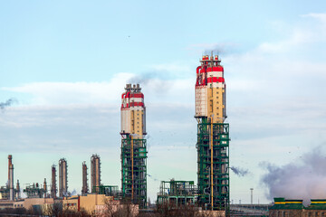ammonia plant for the production of chemical industry building and cooling tower with steam outdoors on the background of sky with clouds, nobody.