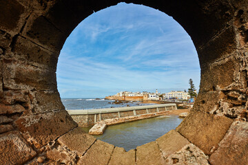Essaouira Ramparts view through a fortress window in Morocco.