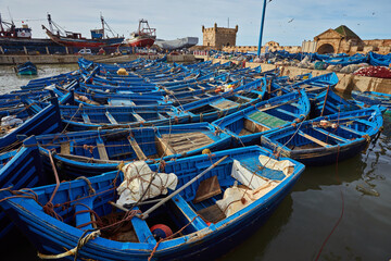 Fototapeta na wymiar Blue fishing boats in the port of Essaouira