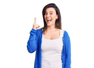 Fototapeta premium Young beautiful woman wearing casual clothes pointing finger up with successful idea. exited and happy. number one.