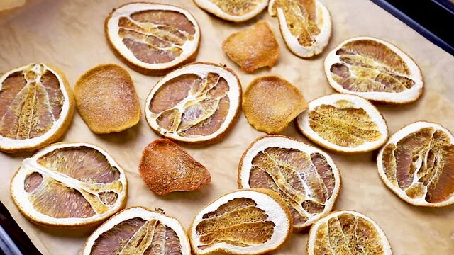 Dried oranges on a baking sheet