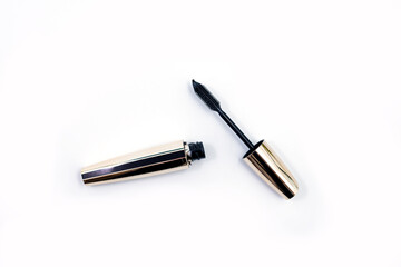 Mascara Black Bottle and Applicator Brush. Fashionable cosmetics Makeup for Eyes, Black Mascara wand and Tube Isolated on White. Extensible mascara and volume.

