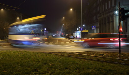night traffic on the street in blur motion, tram lights trails