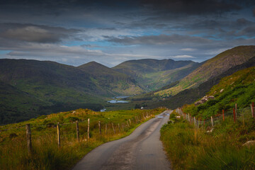 Gravel road leading to direlict house in The Black Valley, Co.Kerry, Ireland, Europe reminds of times past. 2019