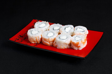 Asian cuisine dish, delicious sushi, sushi on a black background, roll you net on a black background