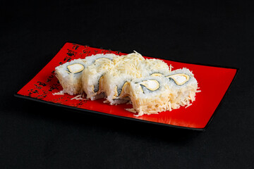 Asian cuisine dish, delicious sushi, sushi on a black background, roll you net on a black background