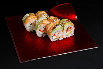 Asian cuisine dish, delicious sushi, sushi on a black background, roll you net on a black background,