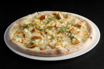 fragrant and hot pizza on a dark background