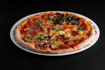 fragrant and hot pizza on a dark background
