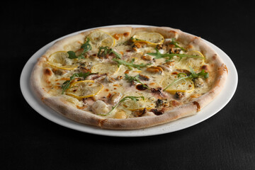fragrant and hot pizza on a dark background