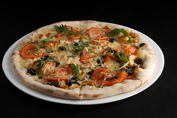 fragrant and hot pizza on a dark background