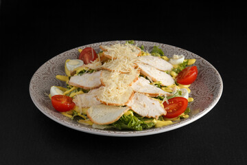 Delicious and healthy salad on a dark background