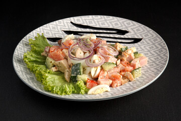 Delicious and healthy salad on a dark background