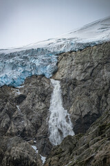 Waterfall comes out of a glacier in Norway