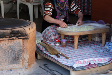 A peasant woman who makes gozleme with cheddar cheese