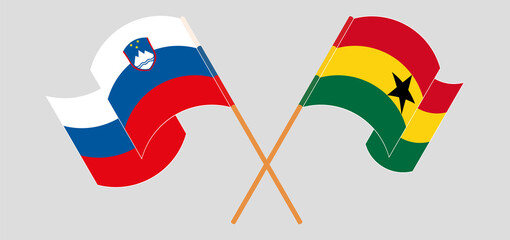 Crossed and waving flags of Slovenia and Ghana