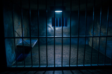 Jail or prison cell. Old grunge prison miniature. Dark prison interior creative decoration. Empty...