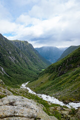 Fototapeta na wymiar River from the Buerbreen glacier down to the valley in Norway