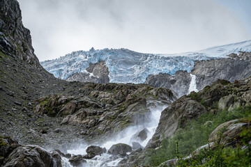 Fototapeta na wymiar Buerbreen glacier with the river in Norway